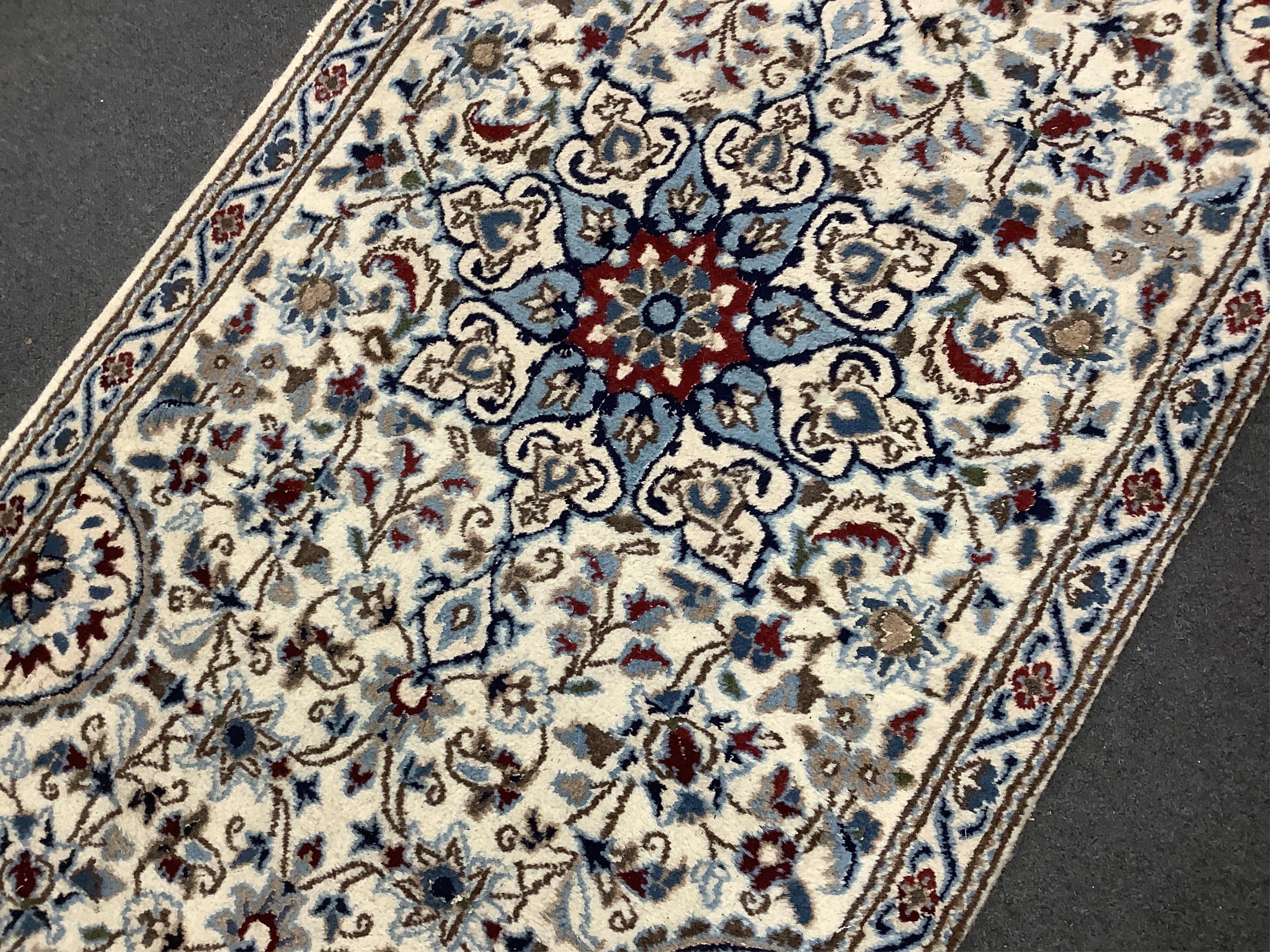 A Nain ivory ground runner, 386 x 86cm